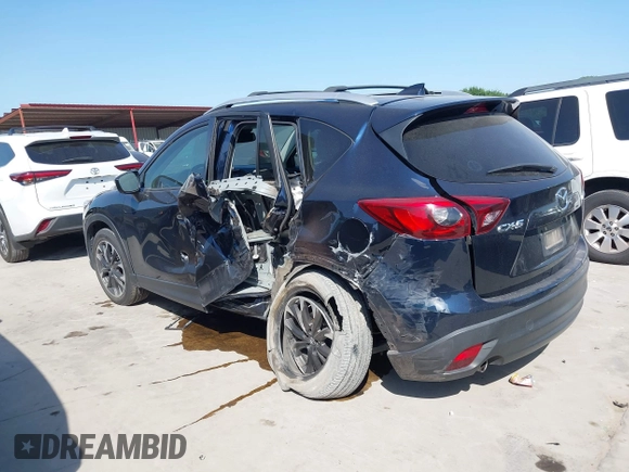 2016 Mazda CX-5 Grand Touring z VIN JM3KE2DY3G0797321, wystawiony jako IAAI lot #42017174 z przebiegiem 65 505 mil mil oraz . Historia ofert i sprzedaży dostępna na DreamBid. Obrazek 14.