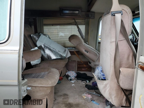 1992 Chevrolet Chevy Van с VIN 1GBEG25K2N7130047, выставлен на аукционе Copart как лот 68682724 с пробегом 143 585 миль миль и Списание • Salvage title. История ставок и продаж доступна на DreamBid. Изображение 11.