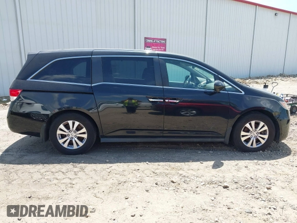 2014 Honda Odyssey EX-L with VIN 5FNRL5H66EB062158, listed as a IAAI auction lot 42072020 with 211,278 mi miles and . Bid and sale history available at carsss.com. Image 13.