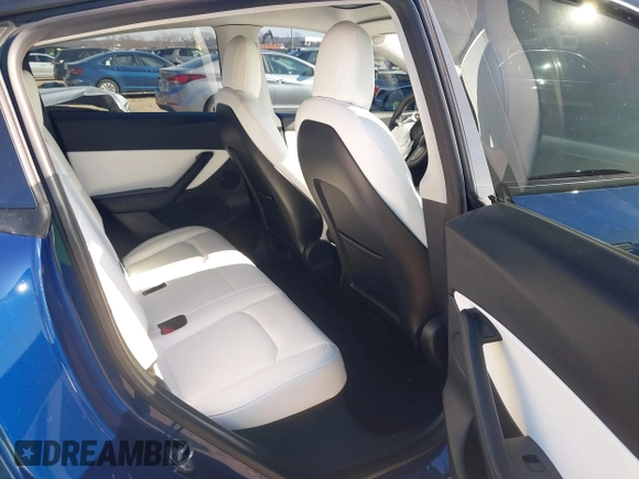 2021 Tesla Model Y Standard Range with VIN 5YJYGDED5MF121874, listed as a IAAI auction lot 41238170 with 72,041 mi miles and . Bid and sale history available at DreamBid. Image 8.