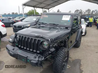 2021 Jeep Wrangler Sport with VIN 1C4GJXAN5MW627228, listed as a IAAI auction lot 42170010 with 56,965 mi miles and . Bid and sale history available at DreamBid. Image 2.