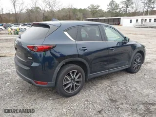 2017 Mazda CX-5 Grand Touring with VIN JM3KFBDL9H0180038, listed as a IAAI auction lot 41394047 with 111,581 mi miles. Bid and sale history available at carsss.com. Image 4.