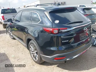 2017 Mazda CX-9 Grand Touring with VIN JM3TCADY5H0129798, listed as a IAAI auction lot 42079754 with 128,403 mi miles and . Bid and sale history available at DreamBid. Image 3.