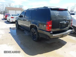 2010 Chevrolet Suburban LTZ with VIN 1GNUKKE39AR106851, listed as a IAAI auction lot 41994155 with 148,776 mi miles. Bid and sale history available at carsss.com. Image 3.