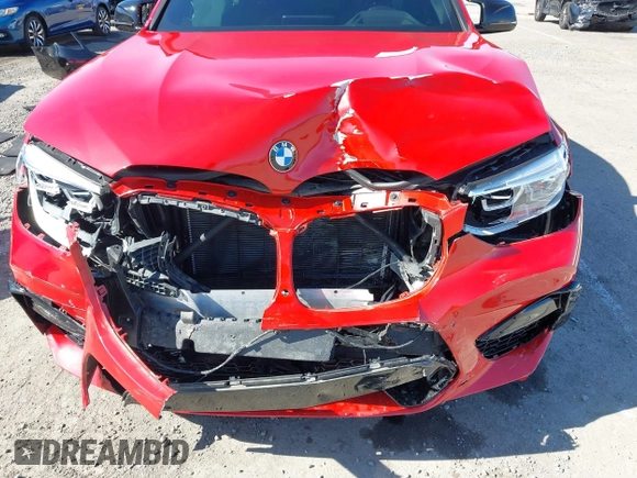 2021 BMW X4 M with VIN 5YMUJ0C08M9H70033, listed as a IAAI auction lot 41671276 with 18,151 mi miles. Bid and sale history available at carsss.com. Image 6.