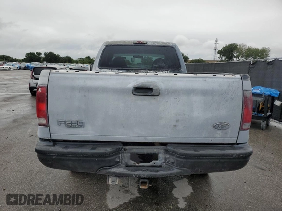 2000 Ford F-250 XL with VIN 1FTNX21F3YED35736, listed as a Copart auction lot 50309805 with 303,811 mi miles and Salvage title. Bid and sale history available at DreamBid. Image 6.