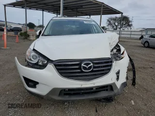 2016 Mazda CX-5 Touring with VIN JM3KE2CY5G0838663, listed as a Copart auction lot 47658065 with 51,470 mi miles and Salvage Title. Bid and sale history available at carsss.com. Image 5.