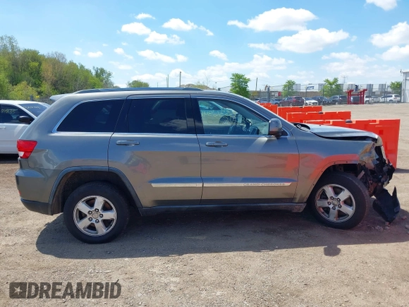 2011 Jeep Grand Cherokee Laredo with VIN 1J4RR4GGXBC587911, listed as a IAAI auction lot 42156885 with 178,999 mi miles and . Bid and sale history available at DreamBid. Image 13.