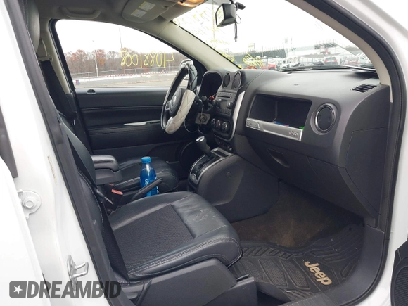 2016 Jeep Compass Latitude with VIN 1C4NJCEA3GD735161, listed as a IAAI auction lot 40881008 with 126,384 mi miles. Bid and sale history available at carsss.com. Image 5.