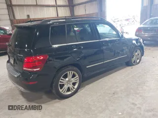 2015 Mercedes-Benz GLK with VIN WDCGG8JB0FG364079, listed as a IAAI auction lot 42096003 with 113,571 mi miles. Bid and sale history available at carsss.com. Image 4.