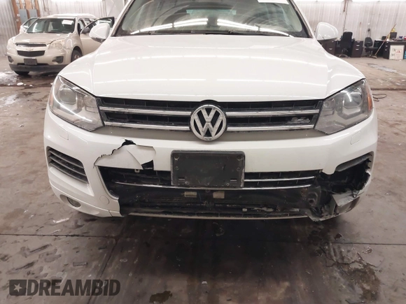 2013 Volkswagen Touareg Lux with VIN WVGEF9BP5DD011511, listed as a IAAI auction lot 41608840 with 167,350 mi miles and . Bid and sale history available at DreamBid. Image 6.