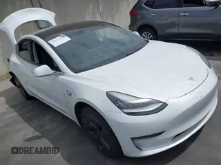 2018 Tesla Model 3 Long Range Battery z VIN 5YJ3E1EA2JF057311, wystawiony jako IAAI lot #42073268 z przebiegiem 93 504 mil mil oraz . Historia ofert i sprzedaży dostępna na DreamBid. Obrazek 1.
