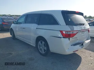 2012 Honda Odyssey Touring with VIN 5FNRL5H93CB125241, listed as a IAAI auction lot 42299053 with 125,549 mi miles and . Bid and sale history available at DreamBid. Image 3.
