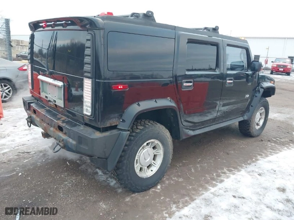2003 Hummer H2 with VIN 5GRGN23UX3H106356, listed as a IAAI auction lot 41185603 with 1 mi miles. Bid and sale history available at carsss.com. Image 4.