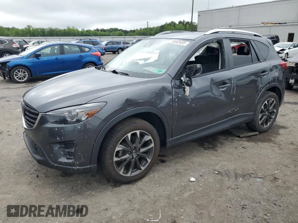 2016 Mazda CX-5 Grand Touring z VIN JM3KE4DY5G0741800, wystawiony jako Copart lot #58565455 z przebiegiem 33 675 mil mil oraz Szkoda całkowita • Salvage title. Historia ofert i sprzedaży dostępna na DreamBid. Obrazek 1.