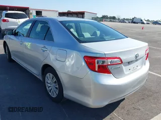 2014 Toyota Camry L with VIN 4T4BF1FK5ER442960, listed as a IAAI auction lot 42206639 with 119,639 mi miles and . Bid and sale history available at DreamBid. Image 3.