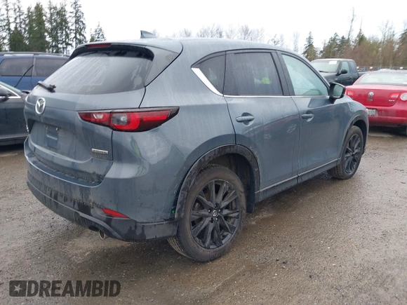 2023 Mazda CX-5 2.5 S Carbon Edition with VIN JM3KFBCM3P0133600, listed as a IAAI auction lot 41693803 with 42,323 mi miles. Bid and sale history available at carsss.com. Image 4.