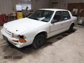 1994 Dodge Spirit z VIN 3B3AA46KXRT214299, wystawiony jako IAAI lot #41908262 z przebiegiem 72 619 mil mil oraz . Historia ofert i sprzedaży dostępna na DreamBid. Obrazek 2.