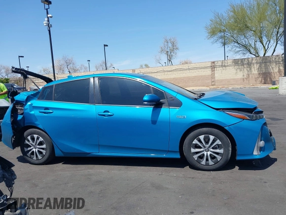 2021 Toyota Prius LE with VIN JTDKAMFP7M3169633, listed as a IAAI auction lot 41986170 with 55,925 mi miles and . Bid and sale history available at DreamBid. Image 14.