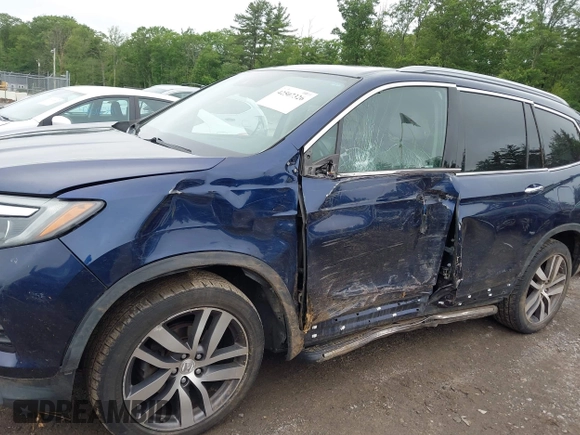 2017 Honda Pilot Touring with VIN 5FNYF6H99HB093136, listed as a IAAI auction lot 42507326 with 125,579 mi miles and . Bid and sale history available at DreamBid. Image 6.