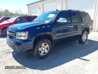 2007 Chevrolet Tahoe LTZ with VIN 1GNFC13077R243921, listed as a IAAI auction lot 41856659 with Not provided miles and . Bid and sale history available at DreamBid. Image 2.