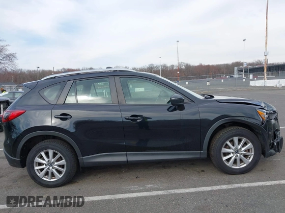 2016 Mazda CX-5 Sport with VIN JM3KE4BY7G0893578, listed as a IAAI auction lot 41853840 with 95,937 mi miles. Bid and sale history available at carsss.com. Image 13.