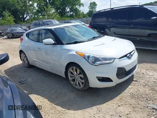 2013 Hyundai Veloster w/Black Int with VIN KMHTC6AD2DU131983, listed as a IAAI auction lot 42671646 with 131,731 mi miles and . Bid and sale history available at DreamBid. Image 1.