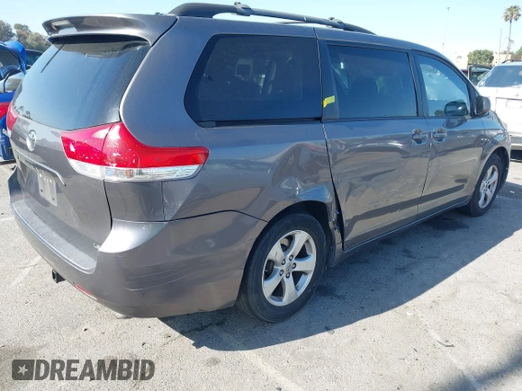 2014 Toyota Sienna LE AAS with VIN 5TDKK3DC6ES521706, listed as a IAAI auction lot 41999188 with 104,867 mi miles. Bid and sale history available at carsss.com. Image 4.