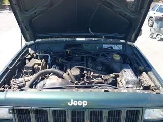 1999 Jeep Cherokee Sport with VIN 1J4FF68S0XL640066, listed as a IAAI auction lot 42768166 with 196,290 mi miles and . Bid and sale history available at DreamBid. Image 10.