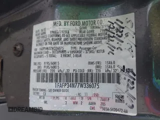 2007 Ford Focus S z VIN 1FAFP34N77W336075, wystawiony jako IAAI lot #42325783 z przebiegiem 153 194 mil mil oraz . Historia ofert i sprzedaży dostępna na DreamBid. Obrazek 9.