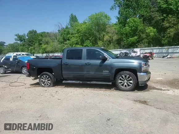 2018 Chevrolet Silverado 1500 LT with VIN 3GCPCREC1JG519228, listed as a Copart auction lot 52293035 with 102,436 mi miles and Salvage Title. Bid and sale history available at DreamBid. Image 13.