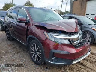 2020 Honda Pilot Touring 8-Passenger with VIN 5FNYF5H94LB012062, listed as a IAAI auction lot 40806740 with 115,431 mi miles and . Bid and sale history available at DreamBid. Image 1.