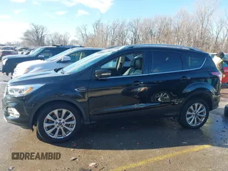 2017 Ford Escape Titanium with VIN 1FMCU0J94HUD58815, listed as a IAAI auction lot 41455415 with 80,421 mi miles and . Bid and sale history available at DreamBid. Image 15.