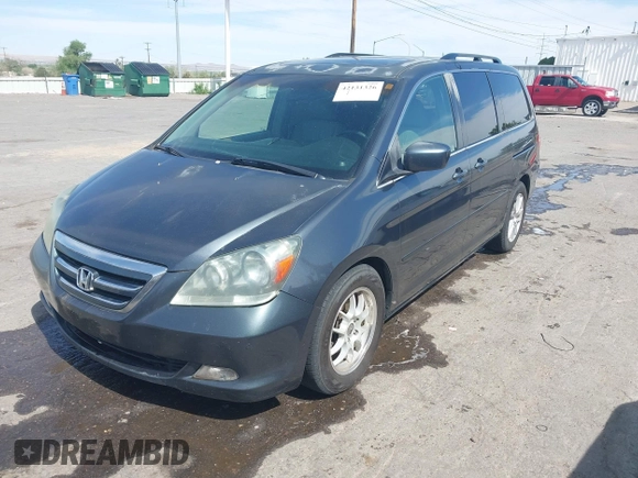 2005 Honda Odyssey TOURING with VIN 5FNRL38855B091754, listed as a IAAI auction lot 42131326 with 258,635 mi miles. Bid and sale history available at carsss.com. Image 2.