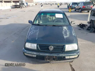 1998 Volkswagen Jetta z VIN 3VWRF61H5WM228558, wystawiony jako IAAI lot #41614111 z przebiegiem 198 205 mil mil oraz . Historia ofert i sprzedaży dostępna na DreamBid. Obrazek 6.