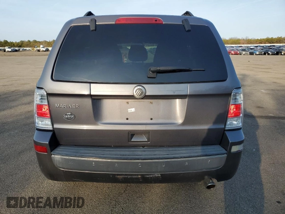 2010 Mercury Mariner z VIN 4M2CN9B70AKJ28137, wystawiony jako Copart lot #48926345 z przebiegiem 100 975 mil mil oraz Szkody całkowita. Historia ofert i sprzedaży dostępna na DreamBid. Obrazek 6.