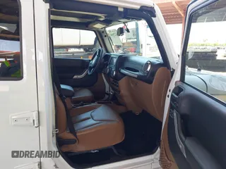 2016 Jeep Wrangler Unlimited Sahara with VIN 1C4BJWEG0GL126270, listed as a IAAI auction lot 42229364 with 50,847 mi miles and . Bid and sale history available at DreamBid. Image 5.