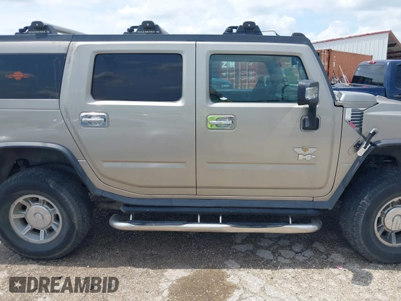 2003 Hummer H2 with VIN 5GRGN23U23H148326, listed as a IAAI auction lot 42068326 with 149,396 mi miles. Bid and sale history available at carsss.com. Image 13.