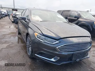 2018 Ford Fusion SE z VIN 3FA6P0LU4JR120900, wystawiony jako IAAI lot #42078440 z przebiegiem 77 020 mil mil oraz . Historia ofert i sprzedaży dostępna na DreamBid. Obrazek 1.