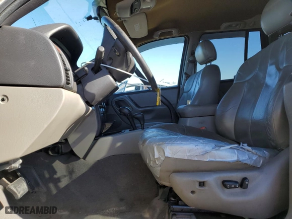 1999 Jeep Grand Cherokee Laredo with VIN 1J4GW58NXXC776438, listed as a Copart auction lot 84412044 with 163,060 mi miles and Salvage Title. Bid and sale history available at carsss.com. Image 7.