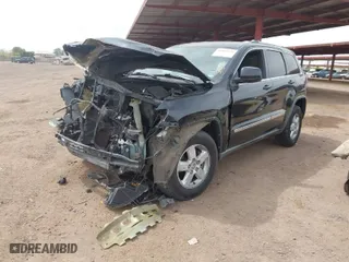 2011 Jeep Grand Cherokee Laredo with VIN 1J4RR4GGXBC506728, listed as a IAAI auction lot 41889334 with 236,099 mi miles. Bid and sale history available at carsss.com. Image 2.