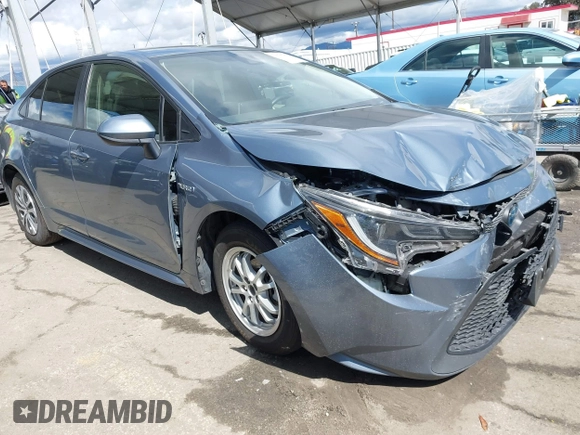 2021 Toyota Corolla Hybrid LE with VIN JTDEAMDE0MJ026601, listed as a IAAI auction lot 41797452 with 85,294 mi miles. Bid and sale history available at carsss.com. Image 1.