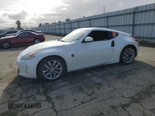 2013 Nissan 370Z z VIN JN1AZ4EH9DM381266, wystawiony jako Copart lot #51125865 z przebiegiem 170 900 mil mil oraz Szkoda całkowita • Salvage title. Historia ofert i sprzedaży dostępna na DreamBid. Obrazek 1.