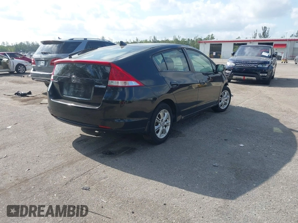 2010 Honda Insight EX with VIN JHMZE2H76AS000837, listed as a IAAI auction lot 42103333 with 146,576 mi miles and . Bid and sale history available at DreamBid. Image 4.