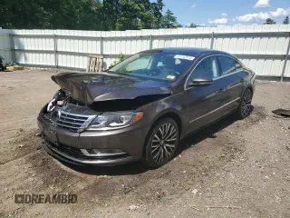 2014 Volkswagen CC VR6 Executive 4Motion with VIN WVWGU7AN3EE539874, listed as a Copart auction lot 61742974 with 124,358 mi miles and Salvage Title. Bid and sale history available at carsss.com. Image 1.