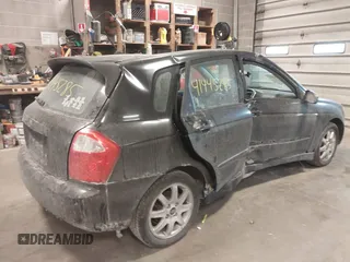 2005 Kia Spectra with VIN KNAFE161255083357, listed as a IAAI auction lot 41445285 with 90,349 mi miles. Bid and sale history available at carsss.com. Image 6.