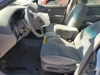 2000 Ford Taurus SE with VIN 1FAFP53U3YG259124, listed as a Copart auction lot 77363344 with 154,889 mi miles and Salvage Title. Bid and sale history available at DreamBid. Image 7.