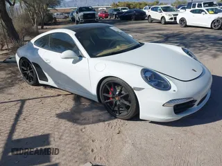 2013 Porsche 911 Carrera S z VIN WP0AB2A96DS123299, wystawiony jako IAAI lot #42248913 z przebiegiem 56 553 mil mil oraz . Historia ofert i sprzedaży dostępna na DreamBid. Obrazek 1.