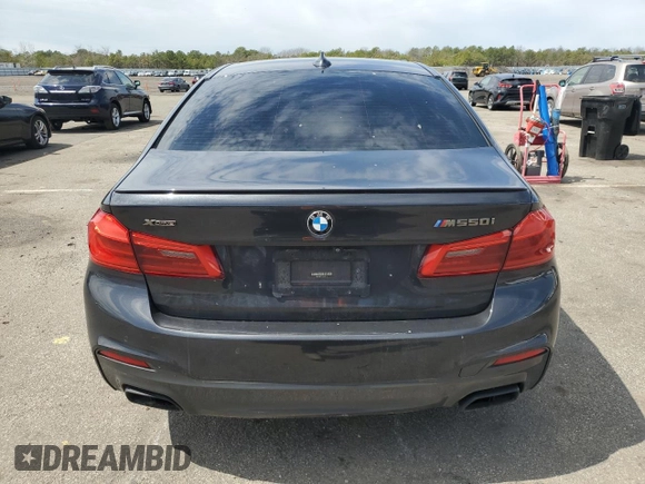 2018 BMW 5 Series M550i xDrive with VIN WBAJB9C57JB286734, listed as a Copart auction lot 52711235 with 127,450 mi miles and Salvage title. Bid and sale history available at DreamBid. Image 6.