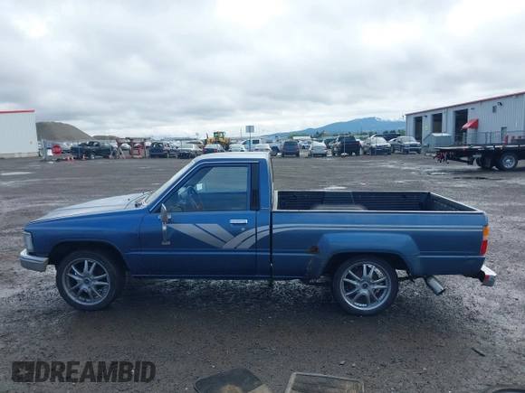 1988 Toyota Pickup with VIN JT4RN50R5J5169942, listed as a IAAI auction lot 42152517 with 218,579 mi miles and . Bid and sale history available at DreamBid. Image 15.